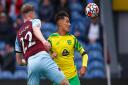 Dimitris Giannoulis battles with Burnley defender Nathan Collins during Norwich City's goalless draw at Turf Moor
