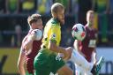 Burnley defender James Tarkowski and Teemu Pukki tussle during Norwich City's 2-0 loss at Turf Moor two years ago