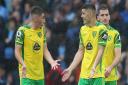 Norwich duo Billy Gilmour and Milot Rashica, right, try to make sense of the third Manchester City goal