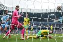 Norwich City goal keeper Tim Krul scores an own goal in the 5-0 Premier League defeat to Manchester City
