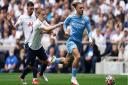 Jack Grealish surges away from former Norwich loanee Oliver Skipp during Manchester City's loss at Tottenham