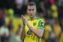 Ben Gibson applauds the Norwich City fans following defeat to Liverpool at Carrow Road