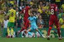 Roberto Firmino of Liverpool scores his sides 2nd goal during the Premier League match at Carrow Road