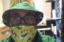 Norwich City fan David Hannant wearing one of the Along Come Norwich face masks. Picture: Daniel Moxon