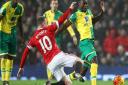 Wayne Rooney of Manchester United and Alexander Tettey of Norwich in action during the match on Saturday. Paul Chesterton/Focus Images Ltd