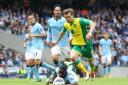 Jonny Howson runs through the Manchester City defence before scoring the winner in Norwich City's 3-2 victory at the Etihad Stadium. Picture: Paul Chesterton / Focus Images