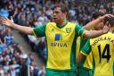Grant Holt celebrates his goal in the 3-2 win over Manchester City. Picture: Paul Chesterton / Focus Images