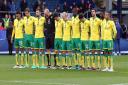 The Norwich City players observe the one minute's silence for Remembrance Day before the QPR fixture. Picture: Paul Chesterton/Focus Images