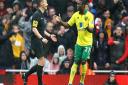 Alex Tettey protests to referee Mike Jones about the penalty award to Arsenal. Picture: Paul Chesterton / Focus Images