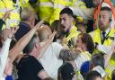 Tempers flare in the stands as police and stewards intervene during the Sky Bet Championship match at Carrow Road, Norwich. Picture date: Friday August 19, 2022.