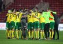 Head coach Daniel Farke leads a spontaneous post-match huddle with his Norwich City squad following victory at Middlesbrough. Picture: Paul Chesterton/Focus Images