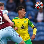 Dimitris Giannoulis battles with Burnley defender Nathan Collins during Norwich City's goalless draw at Turf Moor