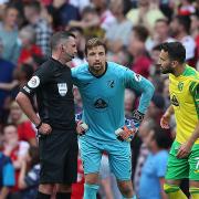 Tim Krul gets an explanation from Michael Oliver following Arsenal's match-winning goal in Norwich City's 1-0 Premier League defeat
