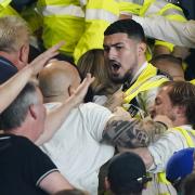 Tempers flare in the stands as police and stewards intervene during the Sky Bet Championship match at Carrow Road, Norwich. Picture date: Friday August 19, 2022.
