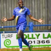 Jamar Loza celebrates after scoring King's Lynn Town's late winner against Woking - the club he has now rejoined