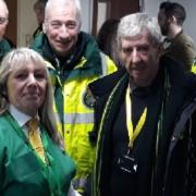 Norwich City fan Paul Mills, with club staff and paramedics who saved his life. Picture: Courtesy of Paul Mills