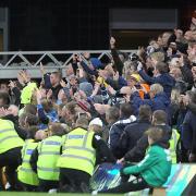 The traveling Leeds fans celebrate their side's 3rd goal during the Sky Bet Championship match at Carrow Road, Norwich in 2016. Picture by Paul Chesterton/Focus Images Ltd.