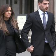 Ched Evans leaving the Court of Appeal in London with partner Natasha Massey. Photo: PA Video/PA Wire