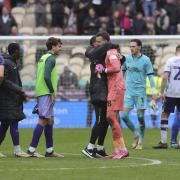 Angus Gunn gets a hug as City celebrate a vital win at Deepdale
