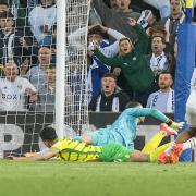 Georgino Rutter slots Leeds' third in a Championship play-off semi-final, second leg rout of Norwich City at Elland Road