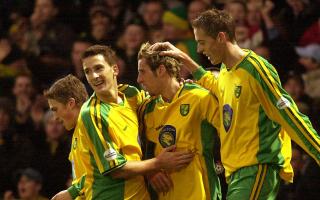 Teammates congratulate Darren Huckerby for his match-winning goal during Norwich City's 1-0 victory over Crewe Alexandra at Carrow Road on November 29, 2003.